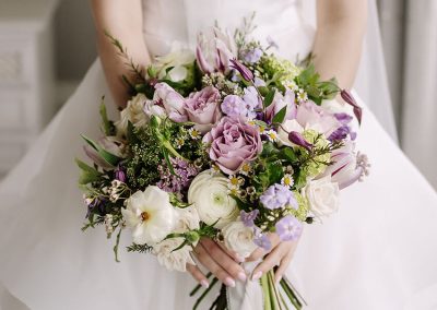 Close-up of a wedding bouquet featuring soft pink and white roses with delicate mixed blooms, by The Flower Shed Westerleigh